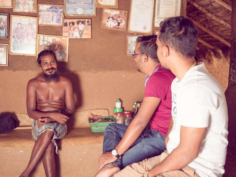 The owners of Mapakada Village Mahiyanganaya in conversation with a chief of the Vedda community